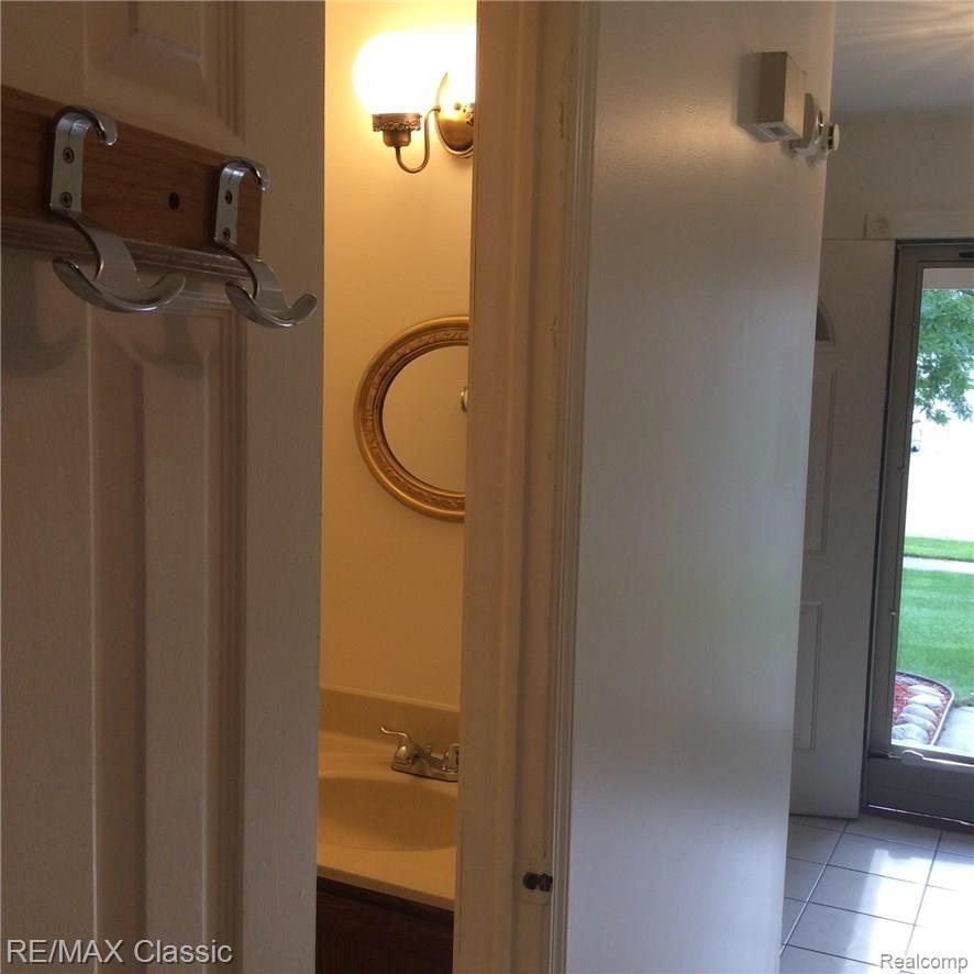 704 Burlington Road Canton, MI 48188 - Photo 24 of 40 1st floor power room and front door of home