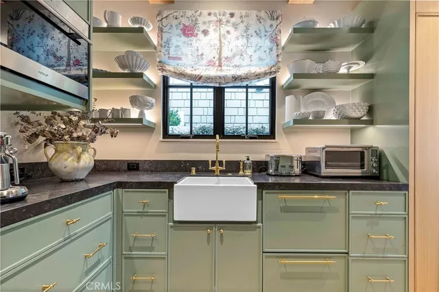 a kitchen with a sink and cabinets