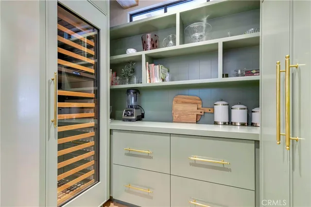 a kitchen with a cabinets and a potted plant