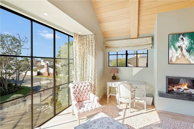 a outdoor living space with furniture and a floor to ceiling window