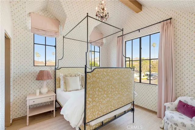 a bed room with a bed and a window