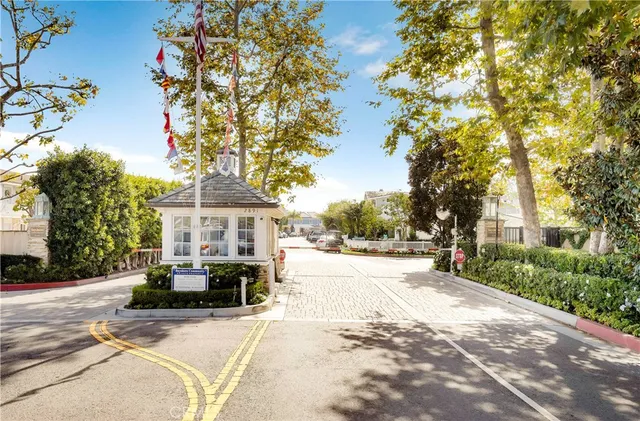 a view of a house with a tree in the background