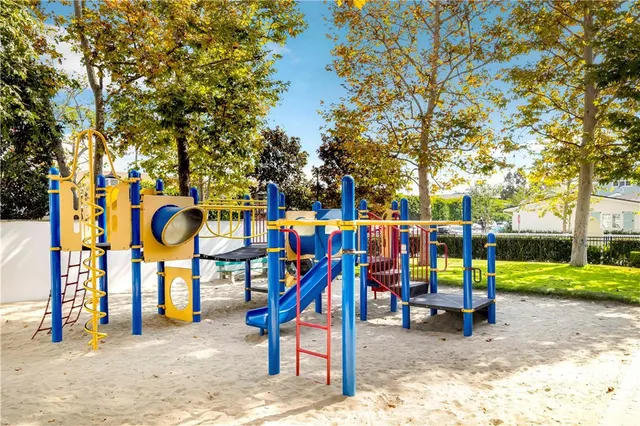 a view of a park with swings and slides