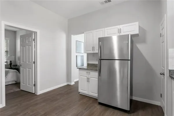 a kitchen with a refrigerator and a refrigerator