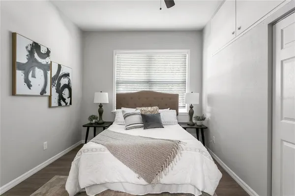 a bedroom with a bed and window