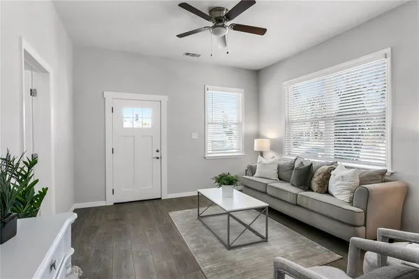 a living room with furniture and a large window
