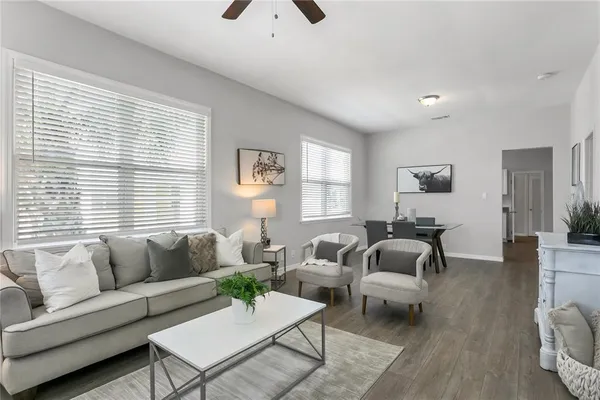 a living room with furniture and a large window
