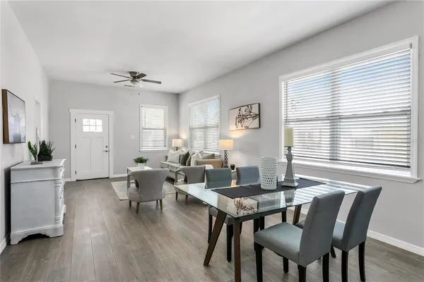 a view of a dining room with furniture window and wooden floor