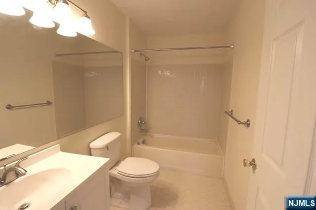 a bathroom with a shower a toilet and a shower