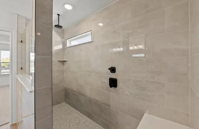 a bathroom with a double vanity sink and mirror with shower