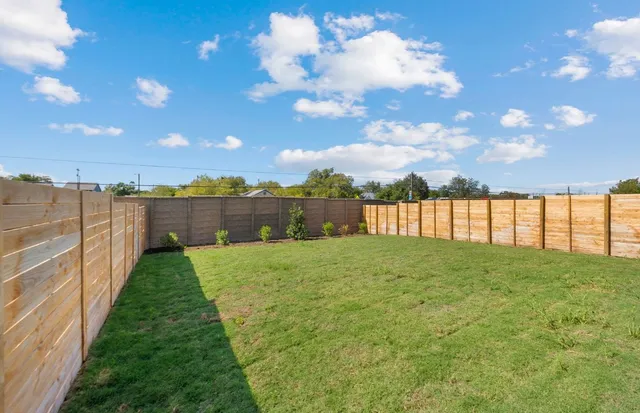 a view of a backyard of a house