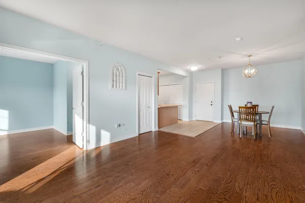a view of a livingroom with furniture and a kitchen