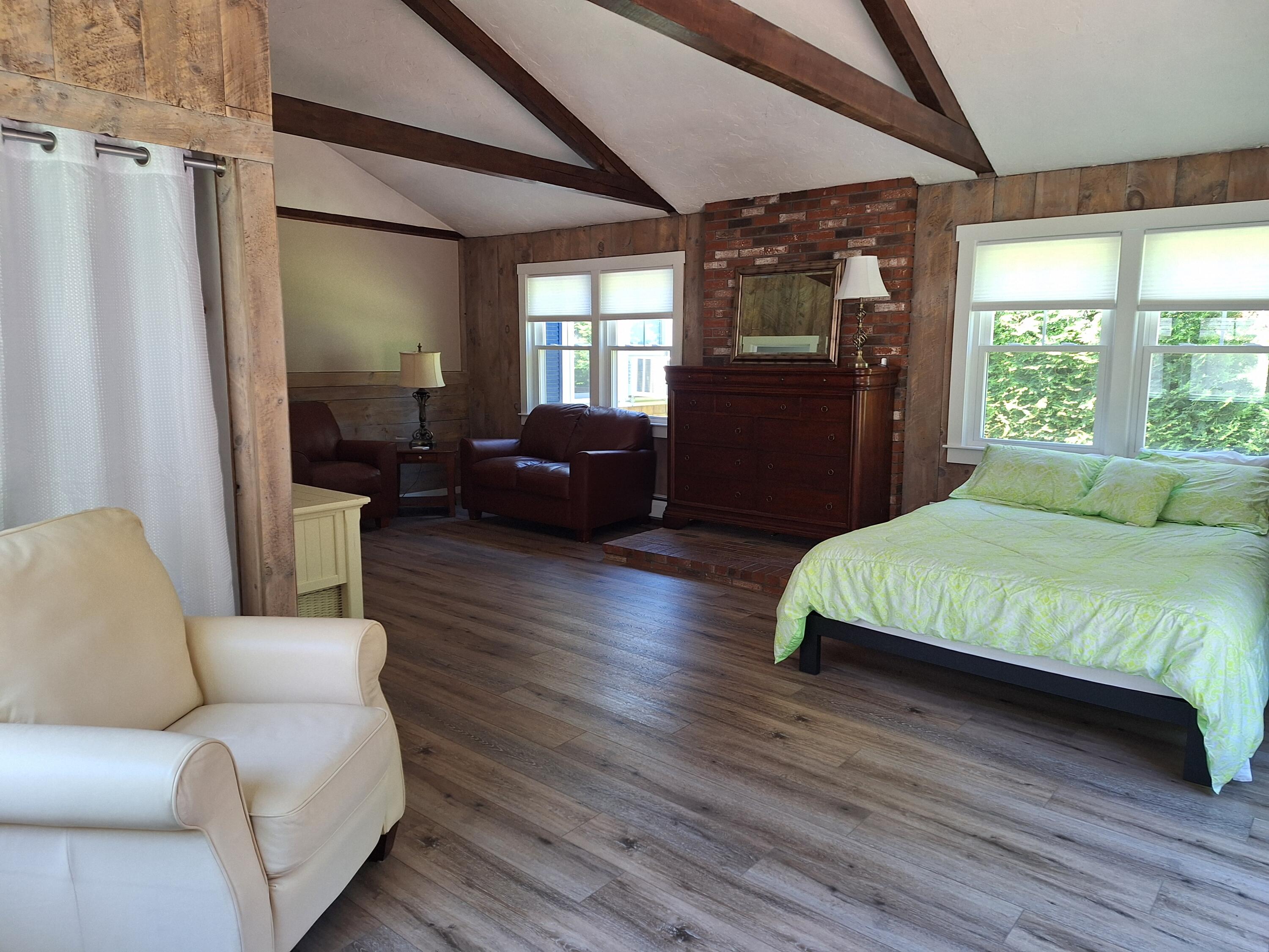 7 Chipman Road Sandwich, MA 02563 - Photo 39 of 45 a spacious bedroom with a bed couch and a window