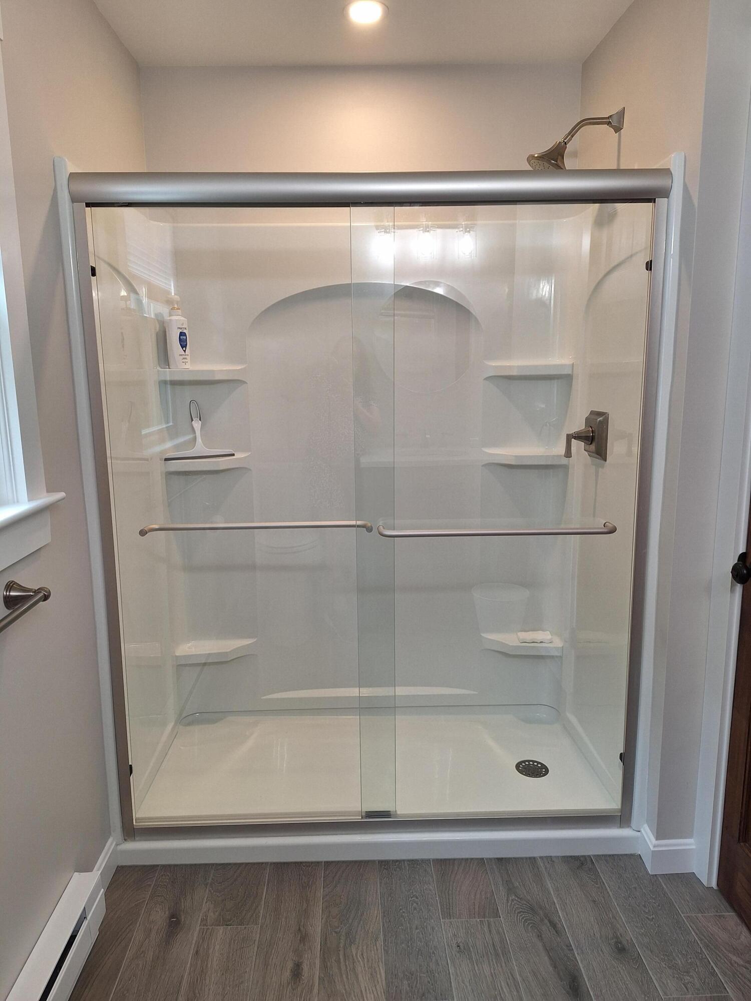 7 Chipman Road Sandwich, MA 02563 - Photo 41 of 45 a bathroom with a glass shower door