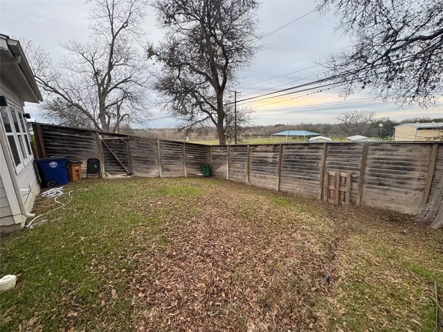 a view of a balcony with two chairs