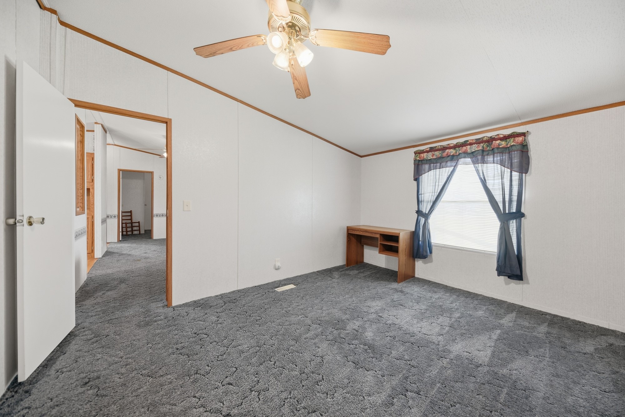 1901 Newsom Road Bellville, TX 77418 - Photo 12 of 20 an empty room with windows and fan