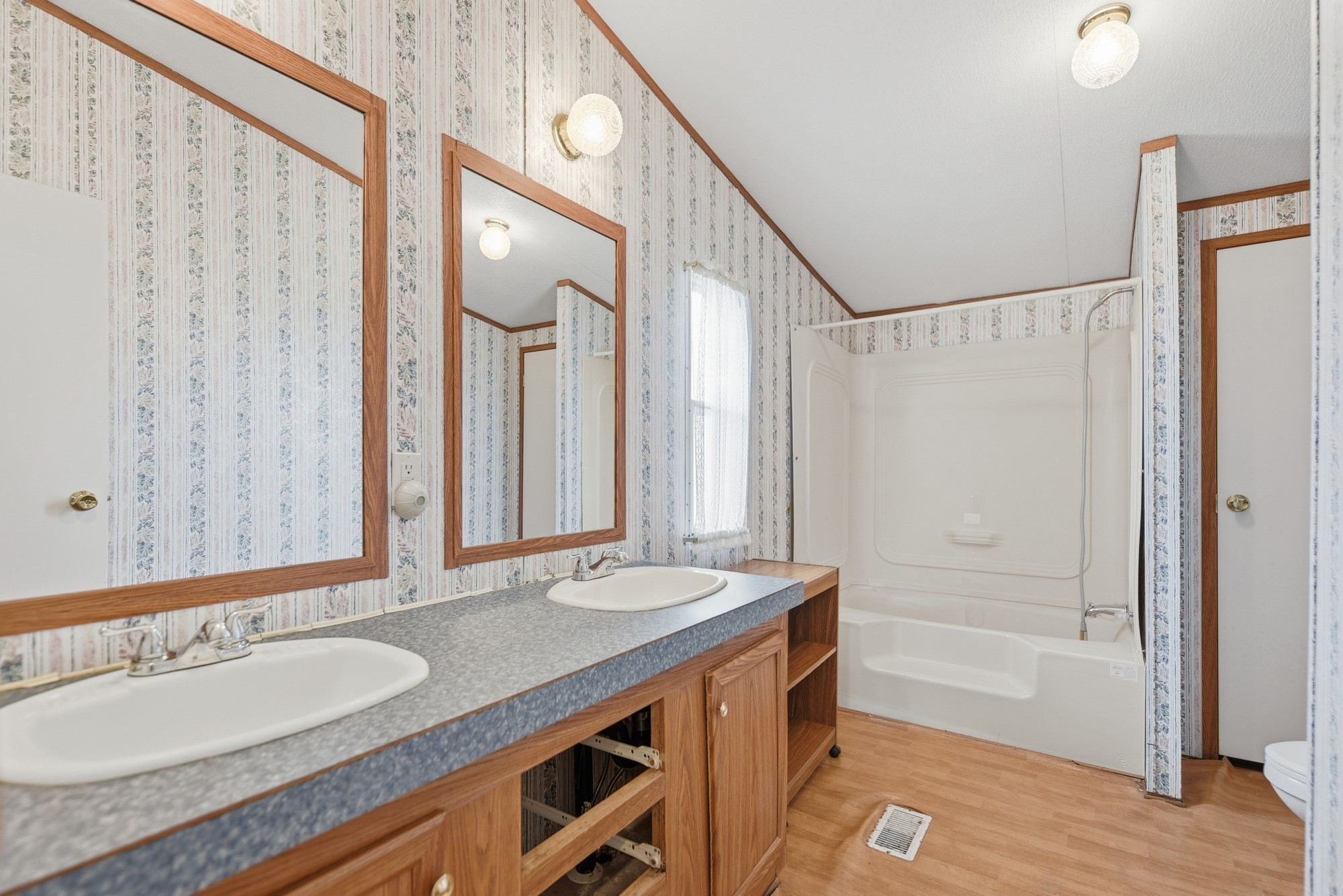 1901 Newsom Road Bellville, TX 77418 - Photo 13 of 20 a bathroom with a granite countertop sink and a mirror