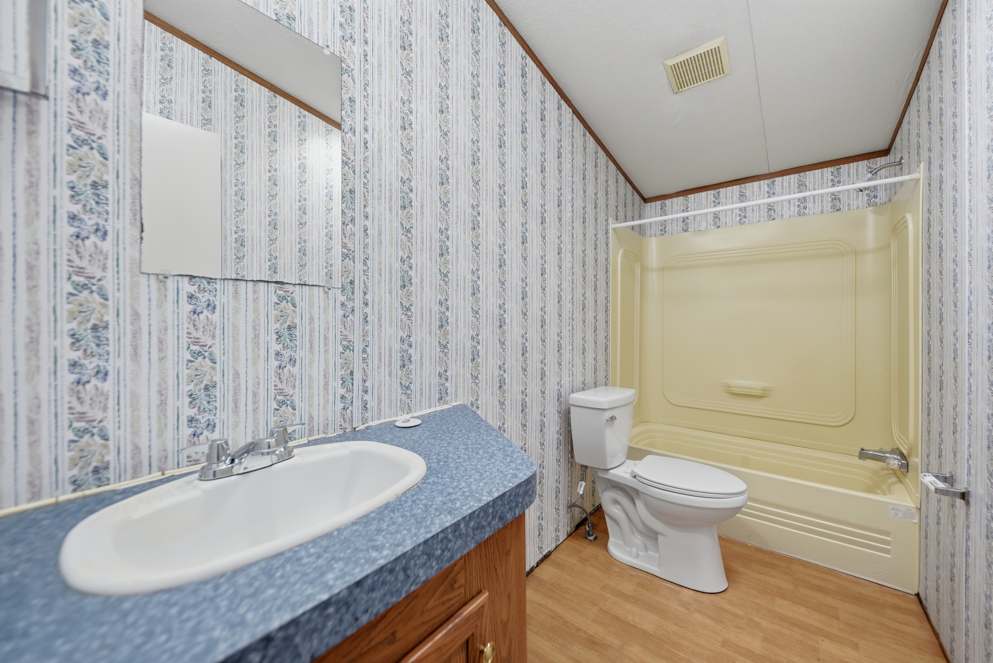 1901 Newsom Road Bellville, TX 77418 - Photo 15 of 20 a bathroom with a granite countertop sink and a mirror