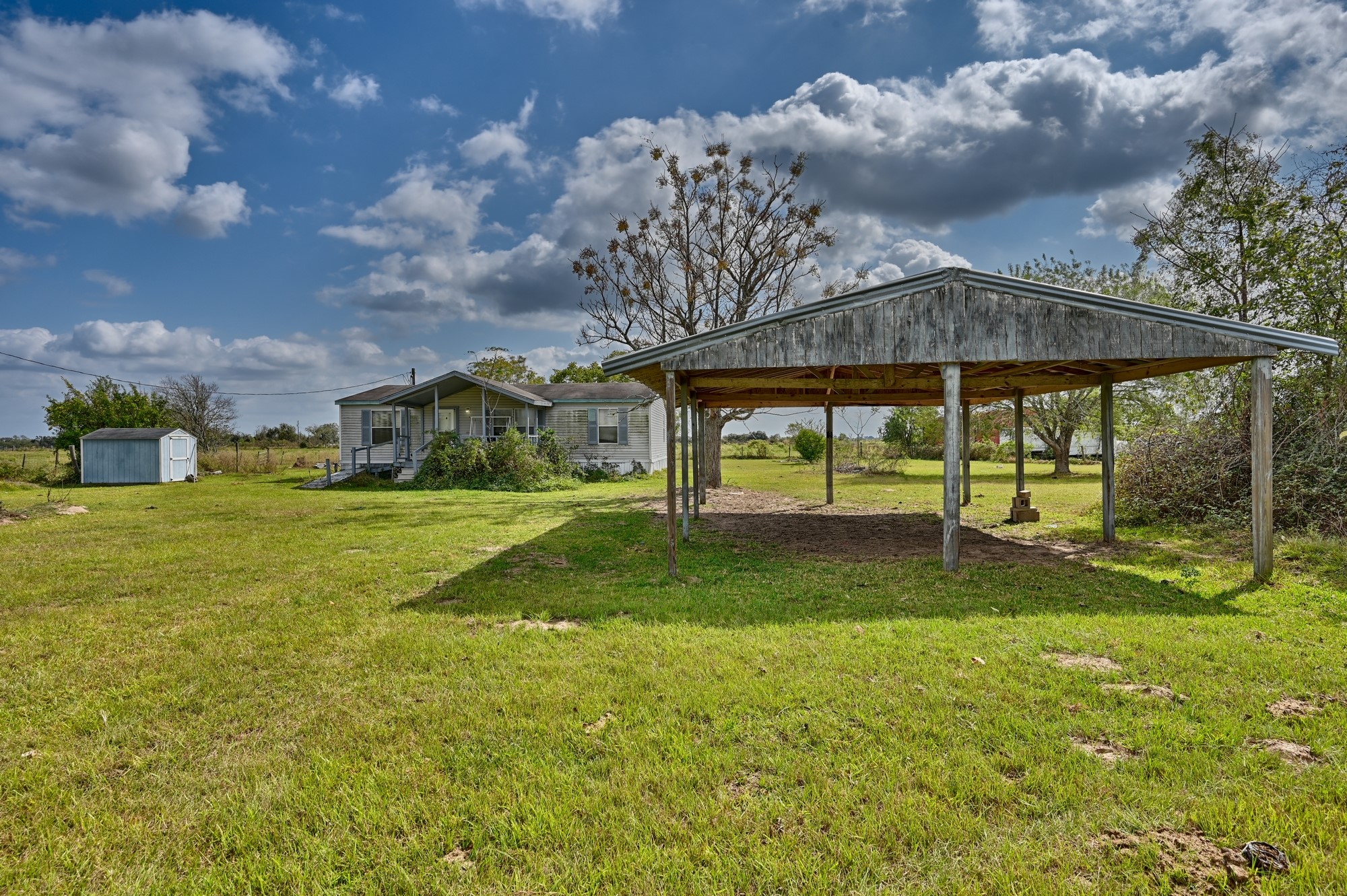 1901 Newsom Road Bellville, TX 77418 - Photo 16 of 20 a view of a house with a yard