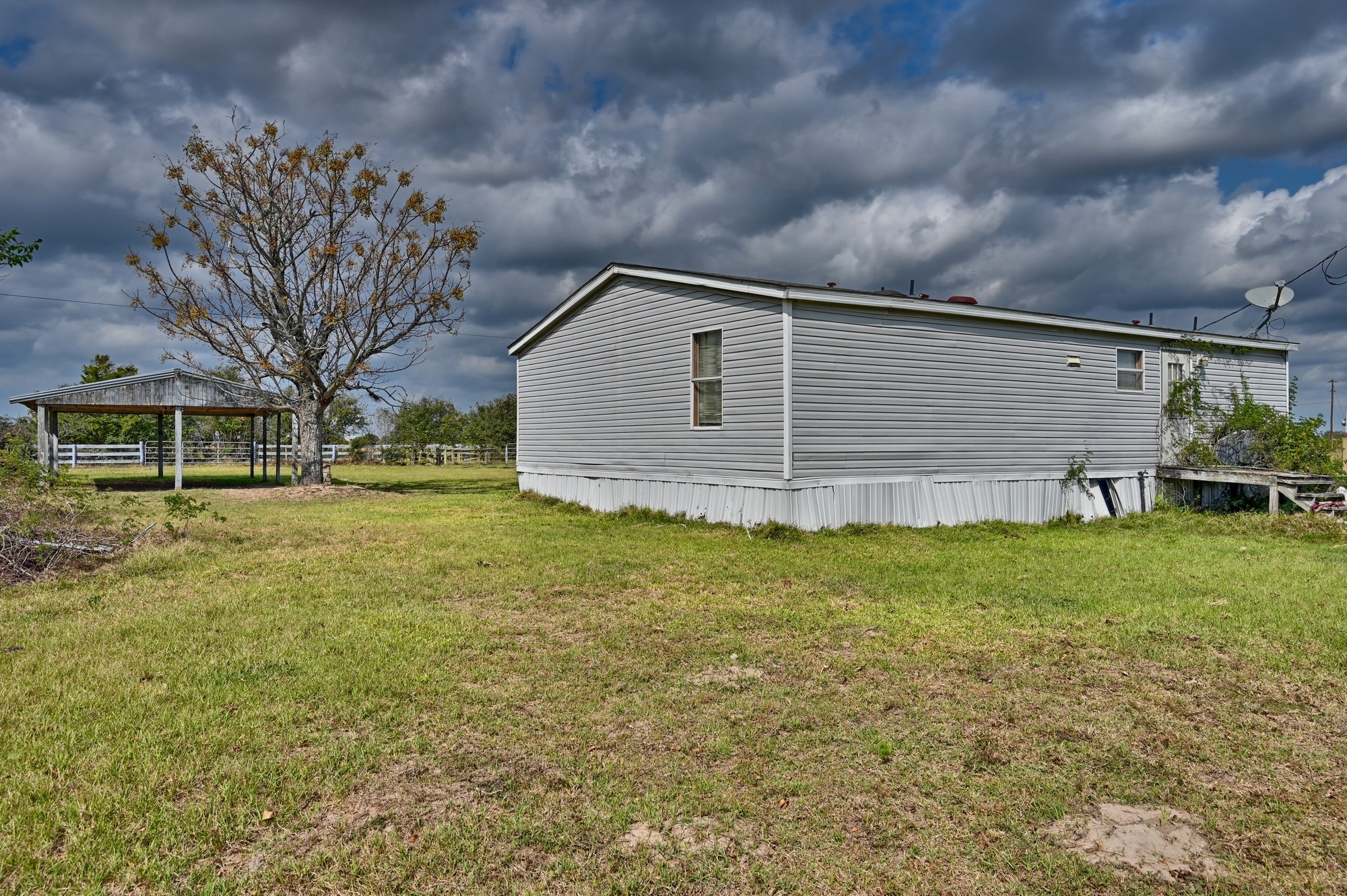 1901 Newsom Road Bellville, TX 77418 - Photo 18 of 20 a backyard of a house with lots of green space