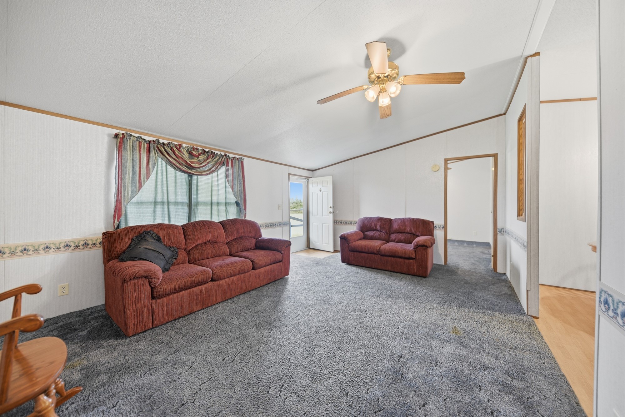 1901 Newsom Road Bellville, TX 77418 - Photo 7 of 20 a living room with furniture and a ceiling fan