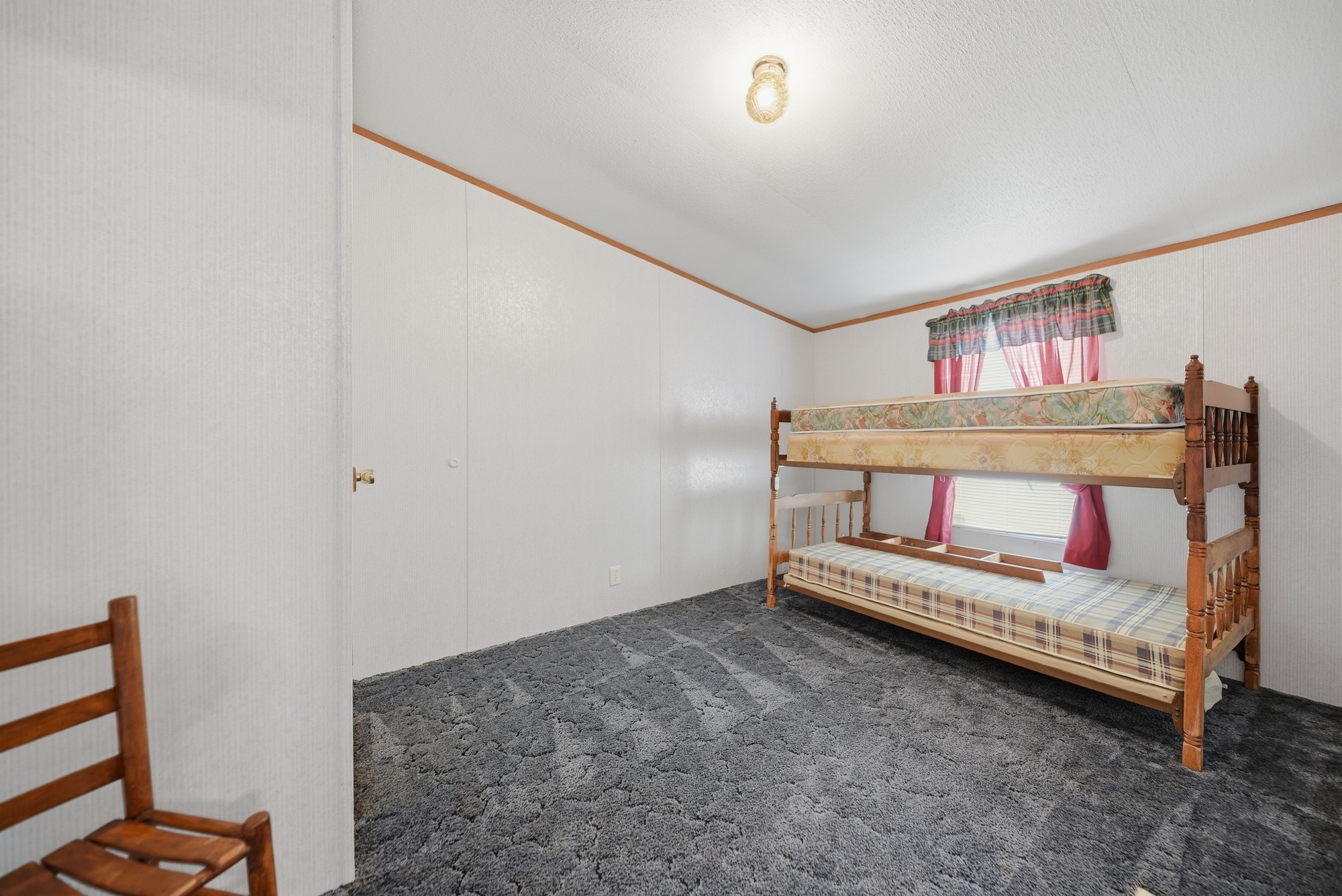 1901 Newsom Road Bellville, TX 77418 - Photo 9 of 20 a bedroom with furniture and a book shelf