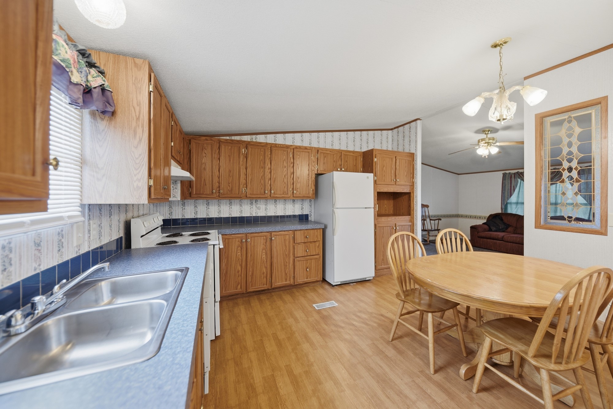 1901 Newsom Road Bellville, TX 77418 - Photo 10 of 20 a kitchen with stainless steel appliances granite countertop a sink dishwasher a stove a refrigerator with island and chairs