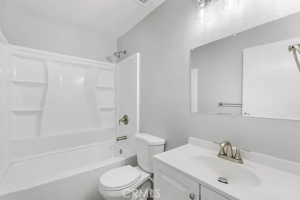 a bathroom with a sink toilet and bathtub