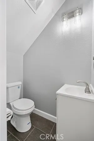 a bathroom with a toilet and a sink