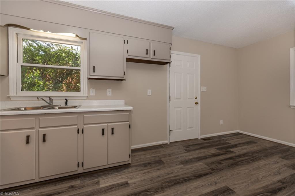 314 Spring Street Thomasville, NC 27360 - Photo 15 of 32 Side entrance into the kitchen and dining area.
