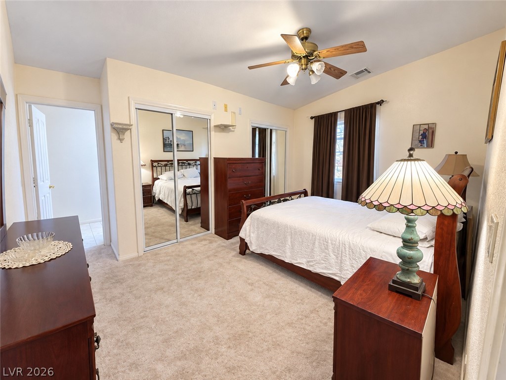 5470 Grain Mill Road Pahrump, NV 89061 - Photo 35 of 80 Vaulted ceilings and plush carpeting enhance this serene bedroom retreat.