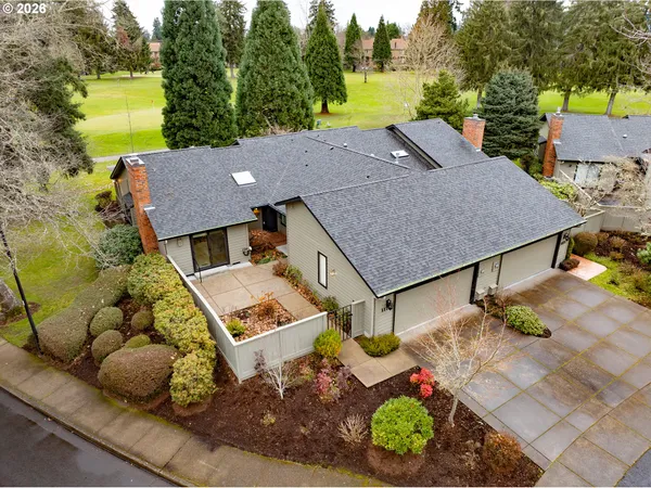 an aerial view of a house with a garden
