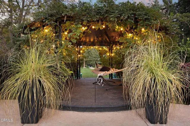 a living room with fireplace furniture and a fireplace