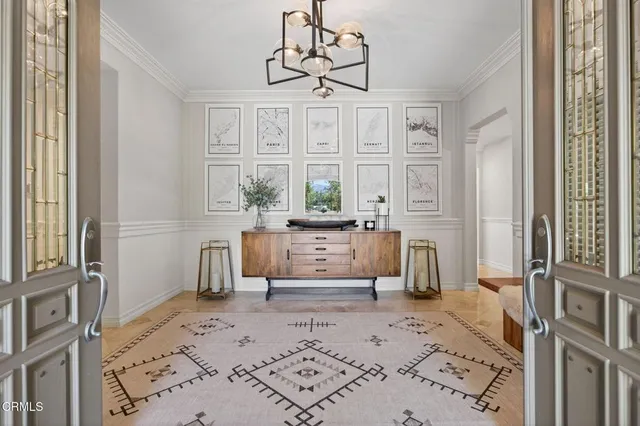 a kitchen with stainless steel appliances granite countertop a stove and white cabinets