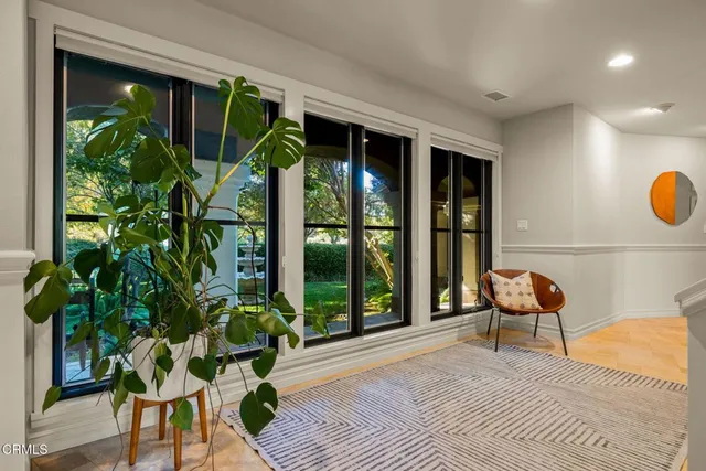 a bedroom with a large bed and a couch