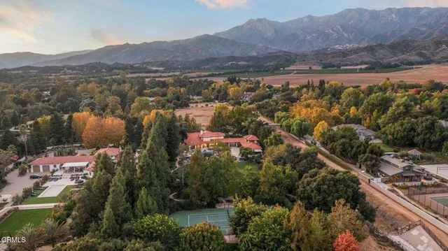 a view of a building with a table and chairs
