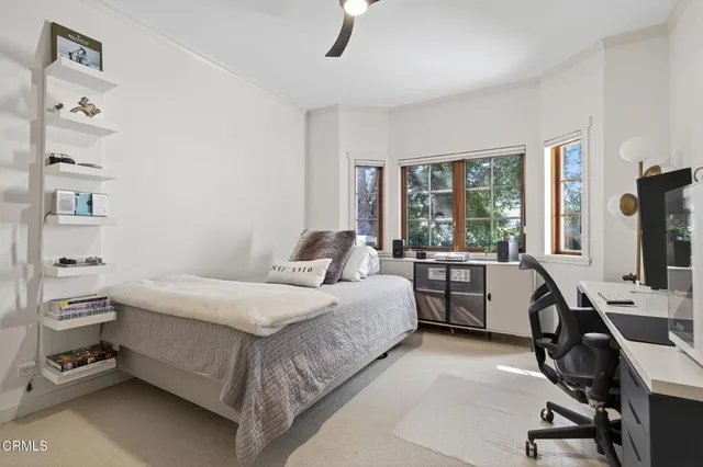 a spacious bathroom with a granite countertop sink mirror and a bathtub