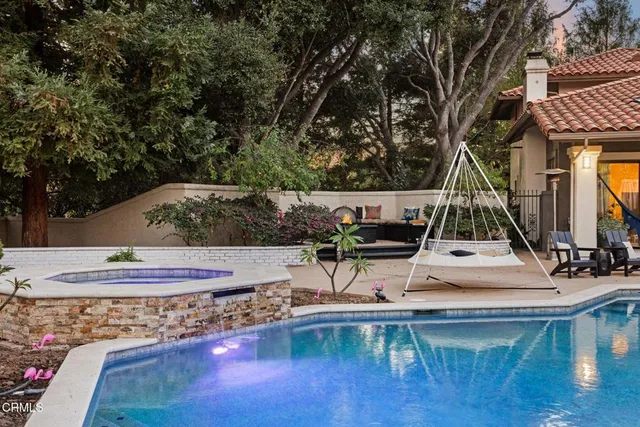 a spacious bathroom with a double vanity sink a large mirror and a bathtub
