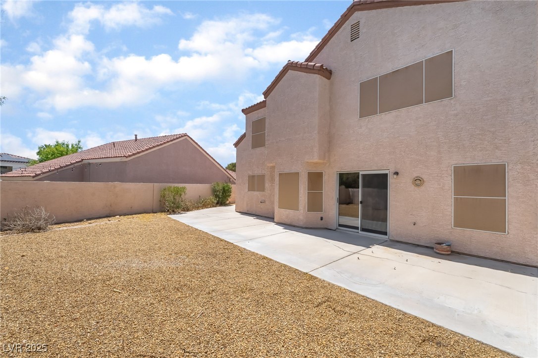 1804 Michaels Court Henderson, NV 89014 - Photo 37 of 44 Back of house with stucco siding, a patio, and a tiled roof