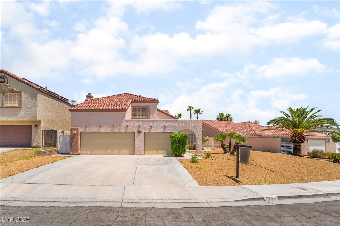 1804 Michaels Court Henderson, NV 89014 - Photo 41 of 44 Mediterranean / spanish house with a tile roof, an attached garage, concrete driveway, and stucco siding