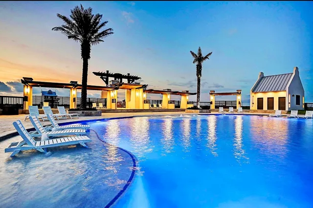 a view of a swimming pool with a lounge chair