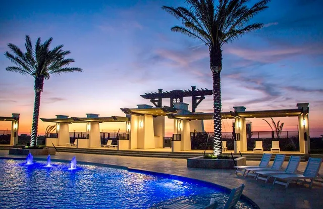 a view of swimming pool with outdoor seating