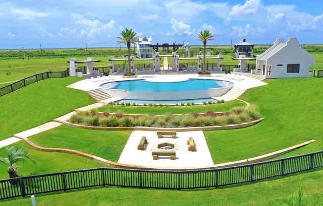 a view of a patio with a table & chairs