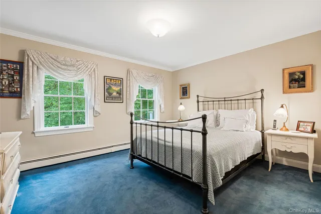 a bathroom with a granite countertop sink a toilet and a mirror