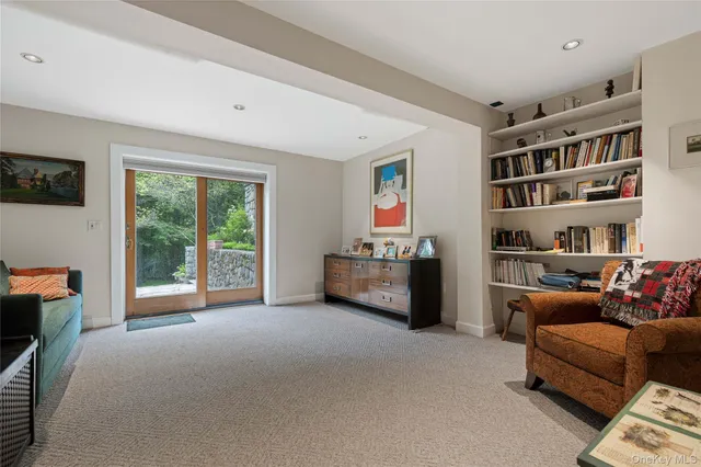 a room with furniture and a book shelf