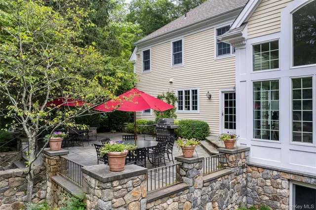 a living room with furniture and a book shelf