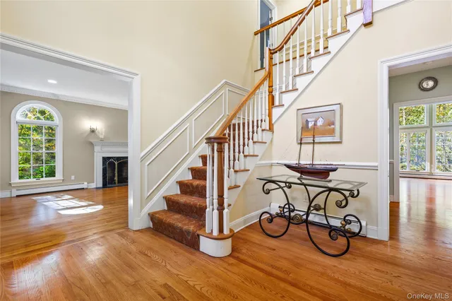 a view of an entryway and wooden floor