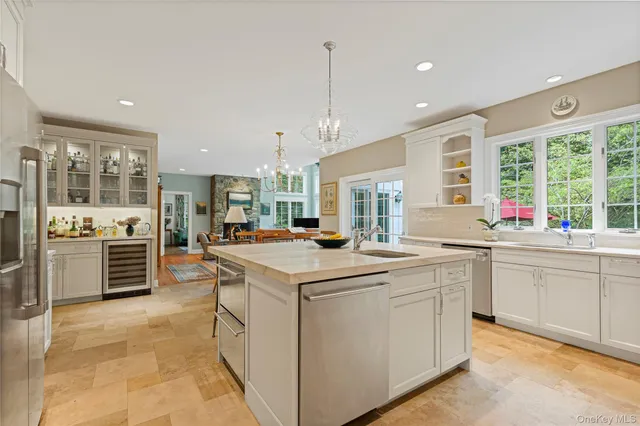 a kitchen with a table chairs stove and cabinets