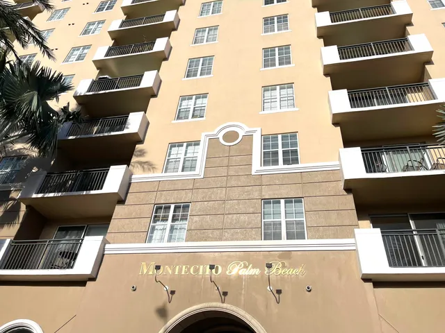 a front view of a building with a parking space