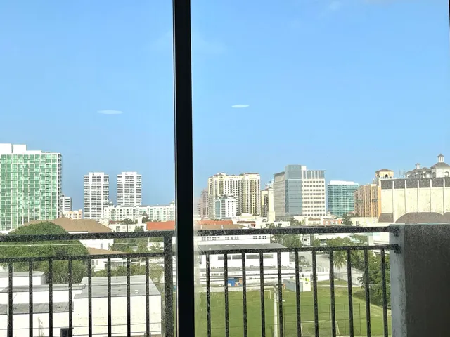a city view from a balcony with city view